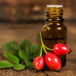 bottle of essential oil of rose hips
